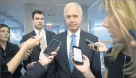  ?? J. Scott Applewhite Associated Press ?? SENATORS began leaving town for the July 4 holiday with no quick fix in sight. “I’m just shocked that we’re going home,” said Sen. Ron Johnson (R-Wis.).