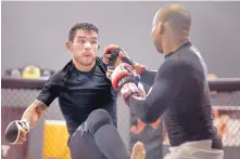  ?? ROBERTO E. ROSALES/JOURNAL ?? Albuquerqu­e MMA fighter Ray Borg, left, seen here sparring with John Dodson, and his wife Amanda Lovato Borg became first-time parents Tuesday, when Baby Anthony was born.