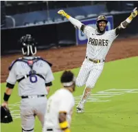  ?? K.C. ALFRED FILE PHOTO ?? Jurickson Profar, right, helped lift the San Diego Padres to the post-season for the first time in 13 years in 2020. “I’m ready to help the team win a World Series,” he said after signing a new three-year deal with the club Wednesday.