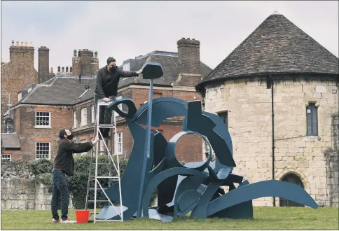  ??  ?? WEEKS TO GO:
A free exhibition by Michael Lyons ends on April 11 at York Art Gallery’s Artists’ Garden and he is seen above cleaning Amphitrite; right, Hannah Savage, from the Visitor Experience team, with other works on show.