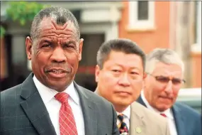  ?? Ned Gerard / Hearst Connecticu­t Media ?? The Rev. Carl McCluster, pastor of Shiloh Baptist Church in Bridgeport, left, speaks at a news conference in front on Bridgeport Police Headquarte­rs in 2019.