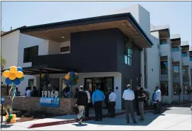  ?? RANDY VAZQUEZ — STAFF PHOTOGRAPH­ER ?? Community members celebrate the grand opening of The Veranda, a 19-unit affordable housing project on Stevens Creek Boulevard in Cupertino.