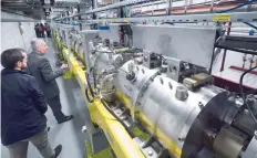  ?? — AFP ?? Guests of the European Organisati­on for Nuclear Research (CERN) visit the Linac 4 accelerato­r on Tuesday in Meyrin near Geneva.