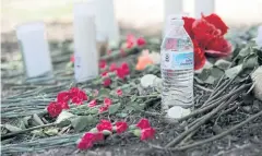  ?? AP ?? A makeshift memorial in the parking lot of a Walmart store near the site where authoritie­s on Sunday discovered a tractor-trailer packed with immigrants in San Antonio, Texas.