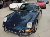  ??  ?? Bottom middle: Parked in their own corner, the 912s made a colourful display