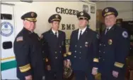  ?? PETE BANNAN - DIGITAL FIRST MEDIA ?? Crozer EMS officers in front of the medic unit that was used to carry the body of Chief Robert Reeder at his funeral Thursday. Left to right, Assistant Chief Jeff Witters, Delco Hospital Chief Richard Micun, and assistant chiefs Larry Worrilow and Chief Bruce Egan.