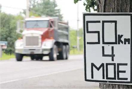  ?? — POSTMEDIA NEWS ?? One reader suggests our roadways would be safer if trucks had a lower posted speed limit than cars, as is the case in Washington State.