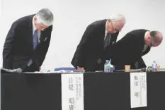  ?? — Reuters ?? Toray Industries’ President Akihiro Nikkaku (L) and his executives bow their heads after a news conference in Tokyo, Japan.