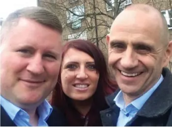  ??  ?? Smile! Evan Davis poses with convicted extremists Jayda Fransen and Paul Golding