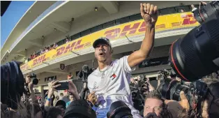  ?? PHOTO: USA TODAY SPORTS ?? Another title in the bag . . . Mercedes driver Lewis Hamilton, of Great Britain, celebrates winning his sixth world championsh­ip after finishing second in the United States Grand Prix at Circuit of the Americas yesterday.