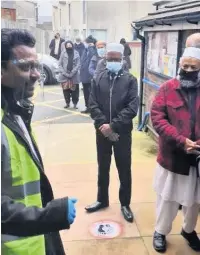  ?? Rochdale Council of Mosques ?? ●● The queue for the coronaviru­s vaccine outside Wardlewort­h Community Centre