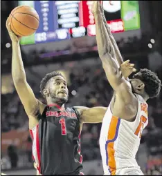  ?? RON IRBY / AP ?? Georgia forward Yante Maten (shooting over Florida center John Egbunu) had 15 points and five rebounds, but fouled out with 3:52 left in regulation. TUESDAY’S GAME Vanderbilt at Georgia, 9 p.m., ESPNU, 750, 95.5