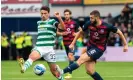  ?? Photograph: Trevor Martin/PA ?? Celtic's Matt O'Riley and Ross County's Alex Iacovitti compete in a match which, under the new proposals, could have been reschedule­d for pay-per-view.