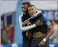  ?? PETR DAVID JOSEK — THE ASSOCIATED PRESS ?? France’s Kylian Mbapp and Presnel Kimpembe celebrate at the end of the semifinal between France and Belgium in St. Petersburg, Russia on July 10.