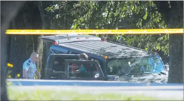  ?? IAN LINDSAY/PNG FILES ?? RCMP investigat­ors search a Hummer SUV in a ditch in 2007. Suspected drug dealer Leonard Pelletier suffered a gunshot wound during the incident.