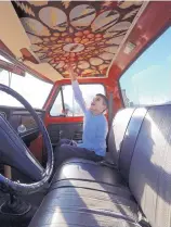  ??  ?? Jaime Garcia, 11, examines the interior of Al Naponic’s monster truck parked at the Garcia’s Grand Junction, Colo., home before going for a ride Monday.