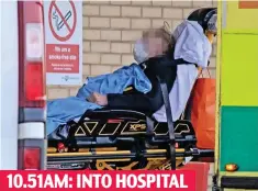  ??  ?? 10.51AM: INTO HOSPITAL Patient wheeled into Queen’s in Romford, Essex, yesterday