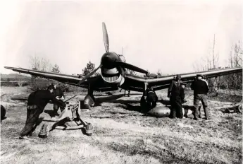  ?? ?? Facing page A Junkers 87 B-2 Stuka of 3./StG2 kicks up the dust as its engine is started at its French base prior to another sortie during 1940.
Left Groundcrew members top up the oil on a Junkers 87 Stuka in France during July 1940.
Below left Oberleutna­nt Otto Schmidt. Below right A Junkers 87 Stuka has its bomb load readied, France, 1940.