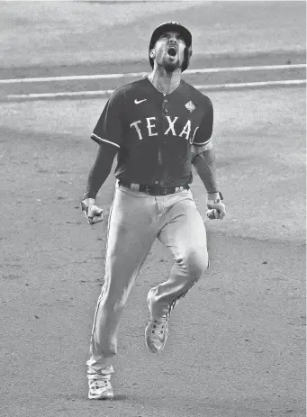  ?? RICK SCUTERI/USA TODAY SPORTS ?? Marcus Semien celebrates his home run in Game 5 of the 2023 World Series.