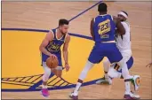  ?? JOSE CARLOS FAJARDO — BAY AREA NEWS GROUP ?? The Warriors’ Draymond Green (23) blocks the Jazz’s Mike Conley as Stephen Curry (30) dribbles past them in the first quarter in San Francisco on Sunday.