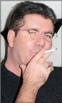  ??  ?? Lighting up: Simon Cowell