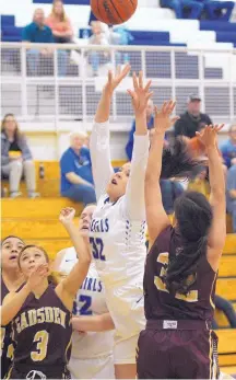  ?? GREG SORBER/JOURNAL FILE ?? Carlsbad’s Kim Best (32) shoots despite heavy pressure during a game against Gadsden on Feb. 20.