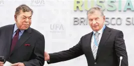  ?? PHOTO: REUTERS ?? File photo of Rosneft CEO Igor Sechin (right) with Chairman of Essar Global Directors’ Board Shashi Ruia during a briefing dedicated to the signing of a contract between Rosneft and Essar Oil Ltd