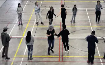  ?? ?? Above: Swift Current workshop participan­ts enjoy a pattern dance, which was traditiona­lly danced during a time of celebratio­n. Below: Dance instructor Amy Seesequasi­s speaks about the history of traditiona­l Métis jigging during the workshop in Swift Current, March 26.