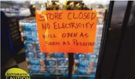  ?? MONTINIQUE MONROE/GETTY IMAGES ?? A sign at a Fiesta Mart in Austin, Texas, informs customers the store is closed due to a power outage on Feb. 17.