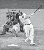  ?? JEROME MIRON/ USA TODAY SPORTS ?? The 2020 World Series has given us a sight we haven’t seen before: A designated hitter wearing the Dodgers’ white home jerseys.