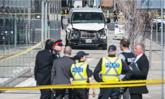  ?? AARON VINCENT ELKAIM/THE CANADIAN PRESS ?? Police in Toronto survey a damaged van after it drove down a busy sidewalk on Yonge Street Monday afternoon, leaving at least 10 dead and 15 injured.