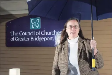  ?? Ned Gerard / Hearst Connecticu­t Media ?? Rev. Cass Shaw, president and CEO of the Council of Churches of Greater Bridgeport, on a rainy Saturday morning in front of her office in Bridgeport.