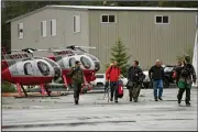  ?? (AP/Ketchikan Daily News/Dustin Safranek) ?? Members of the Ketchikan Volunteer Rescue Squad arrive Thursday in Ketchikan, Alaska, where efforts continued Friday to recover the bodies of six people killed in a plane crash.