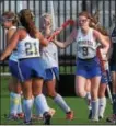  ?? PETE BANNAN — DIGITAL FIRST MEDIA ?? Springfiel­d teammates congratula­te Michaela Travers (9) after she scored in the second half against West Chester Rustin Monday at Springfiel­d High School. The Cougars moved on to the second round of districts with a 2-0 win and will face top-seeded...