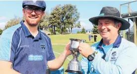  ?? ?? Levin Old Boys captain Dion Sanson presented with the Coastal Challenge trophy by umpire Mike George.