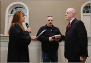  ?? PHOTO COURTESY OF HATFIELD TOWNSHIP ?? Greg Lees, right, is sworn in as a Hatfield Township commission­er by District Judge Andrea Duffy during the board’s Jan. 6 reorganiza­tion meeting.