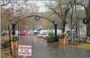  ?? / John Popham ?? Dreary weather doesn’t stop people attending or setting up booths for Saturday’s Christmas in the Country.