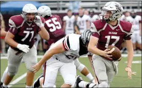  ?? NWA Democrat-Gazette File Photo ?? Siloam Springs senior quarterbac­k Landon Ellis runs away from a Pea Ridge defender Aug. 17 during an Arkansas Activities Associatio­n benefit game.