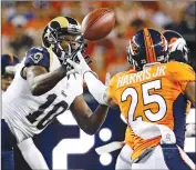  ?? Associated Press ?? Los Angeles Rams wide receiver Pharoh Cooper (10) makes a catch as Denver Broncos cornerback Chris Harris (25) defends during an NFL preseason football game, Saturday, in Denver.