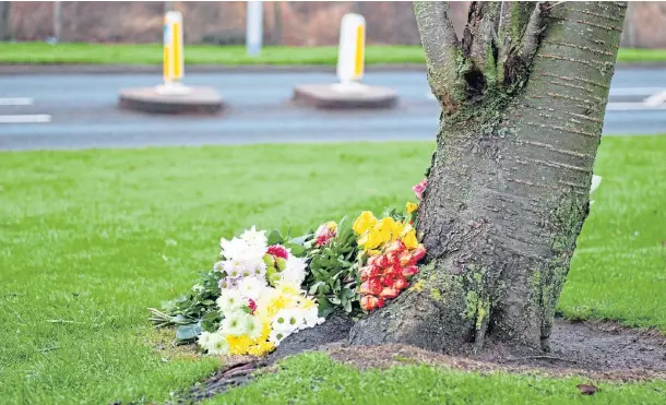  ?? ?? TRIBUTE: Flowers are laid near the scene of the collision which left a 61-year-old woman dead in the Borrowfiel­d area of Montrose.