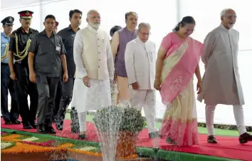  ?? — PTI ?? President Pranab Mukherjee, with Prime Minister Narendra Modi and parliament­ary affairs minister Ananth Kumar, proceeds to Parliament’s Central Hall for his farewell ceremony in New Delhi on Sunday. Vice-president Hamid Ansari and Lok Sabha Speaker...