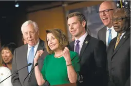  ?? DREW ANGERER/GETTY IMAGES ?? House Minority Leader Nancy Pelosi, center, House Minority Whip Steny Hoyer, left, Rep. Eric Swalwell, Rep. Joe Crowley and Rep. James Clyburn hold a joint press conference.