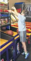  ?? Suzanne Garofalo / Houston Chronicle ?? Danny, who lives in Memorial, shoots hoops at Chuck E. Cheese’s Westheimer location.