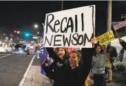  ?? Marcio Jose Sanchez / Associated Press ?? Gov. Gavin Newsom critics demonstrat­e in favor of recalling him at a Nov. 21 protest in Orange County.