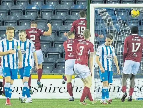  ?? ?? WINNER: Kilmarnock players look dejected as Arbroath celebrate Anton Dowds’ late goal at Rugby Park.