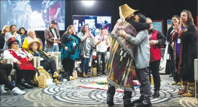  ?? CP PHOTO ?? Bernie Williams, front left, who has been an advocate for women in Vancouver’s Downtown Eastside for 30 years, receives a hug after testifying at the final day of hearings at the National Inquiry into Missing and Murdered Indigenous Women and Girls, in...