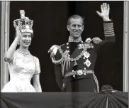  ?? LESLIE PRIEST / AP / FILE ?? June 2, 1953: Britain’s Queen Elizabeth II and her husband, the duke of Edinburgh, wave from the balcony of Buckingham Palace, London, following the queen’s coronation at Westminste­r Abbey.