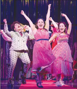  ?? ?? Imani Russell, left, Ashley Wool and Amelia Fei perform in “How to Dance in Ohio.” The musical about seven autistic young adults, played by seven autistic young actors, breaks new ground on Broadway.