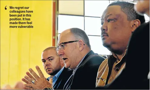  ?? Picture: EUGENE COETZEE ?? UNDER THREAT: NMB mayor Athol Trollip speaks at a media conference on alleged death threats councillor­s Werner Senekal, left, and Rano Kayser have received