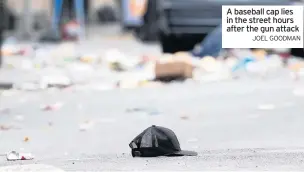  ?? JOEL GOODMAN ?? A baseball cap lies in the street hours after the gun attack